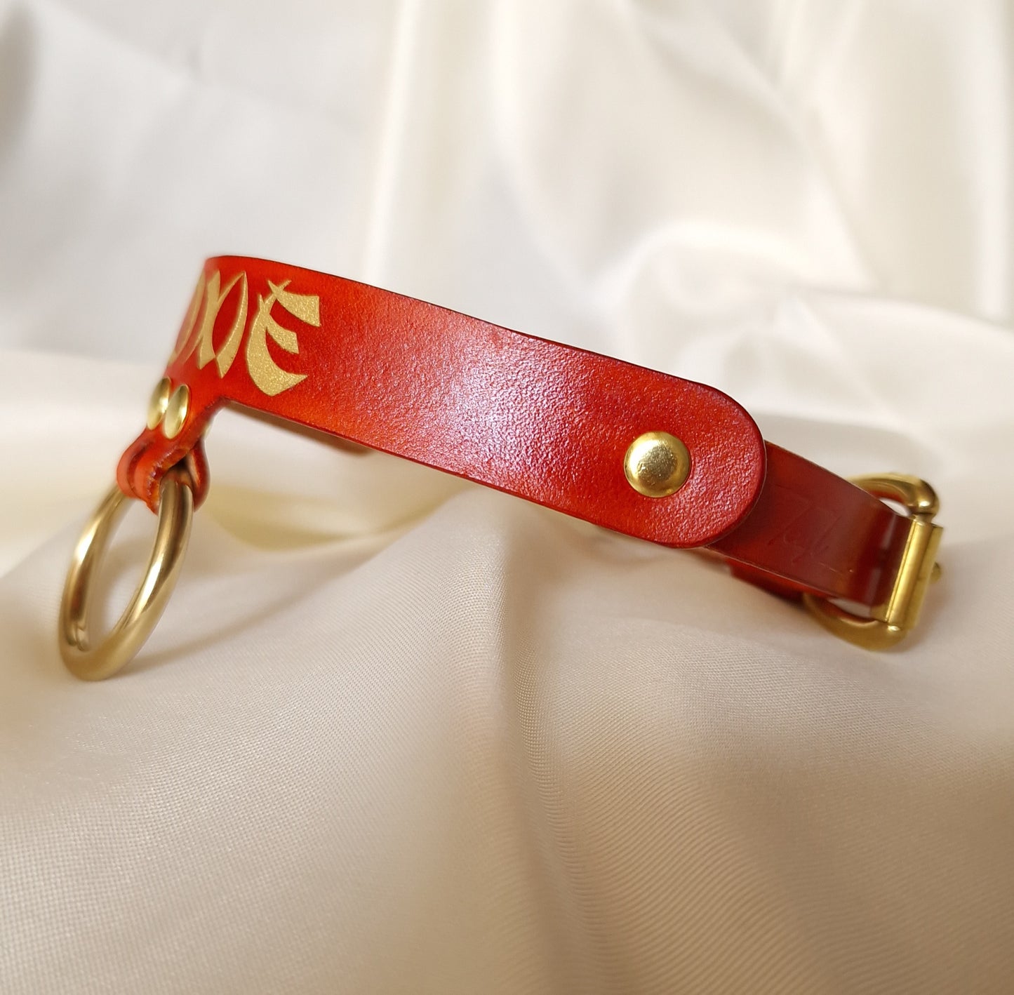 Angled view of artisanal handmade leather choker with detailed edges