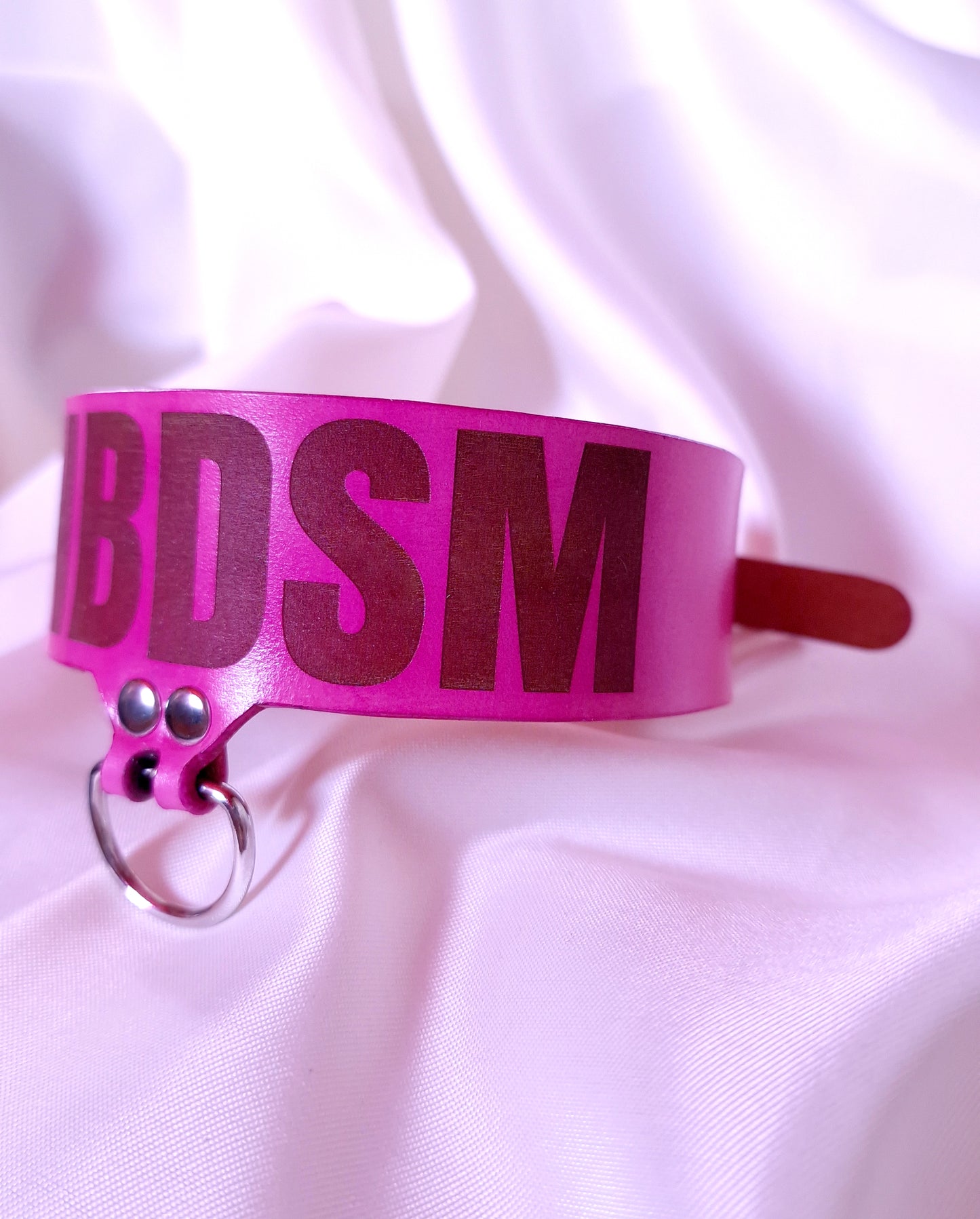 Side view of handcrafted pink leather DNBDSM Matia B-Complex merch choker