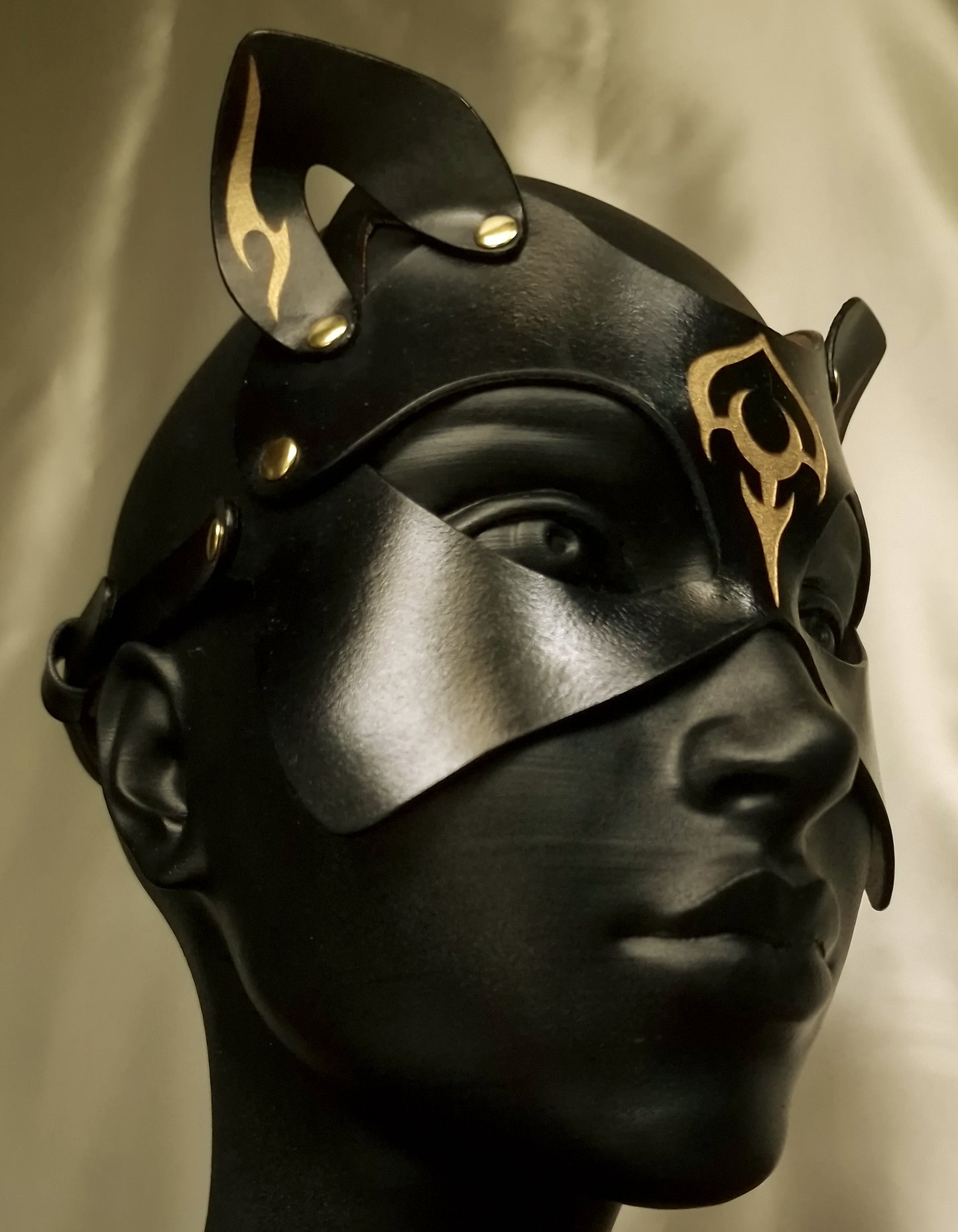 Side profile luna cat mask with ornaments.
