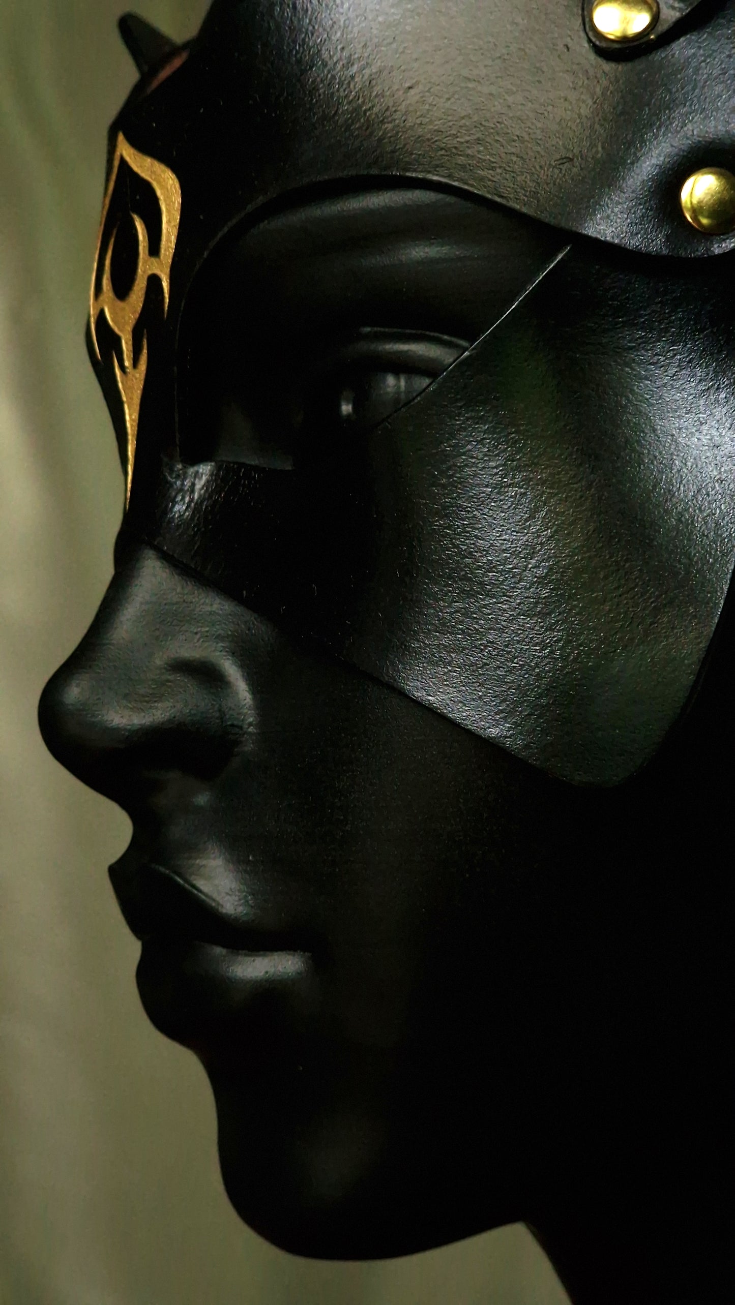 Elegant leather cat mask with lunar detail.
