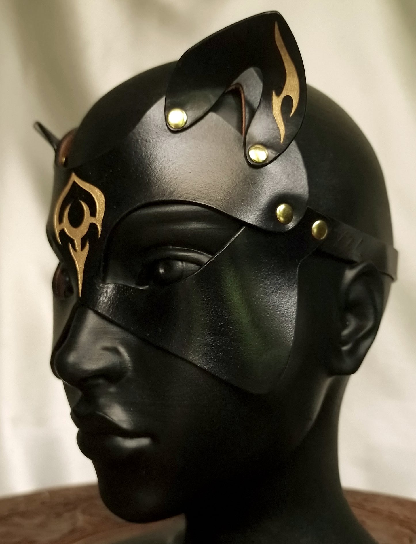 Fetish cat mask with ornaments and tattooes, sculpted shape.