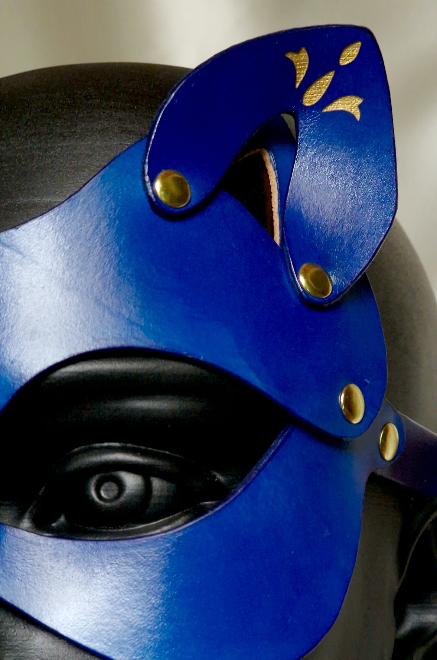 Fetish feline mask with high-end ornamental flourishes for queen, femdom, or dominatrix.