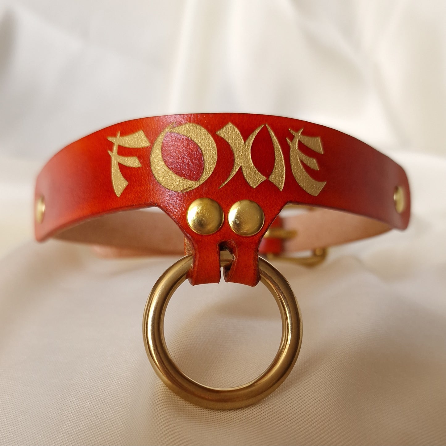 Front view of personalized handmade leather nickname choker with custom inscription