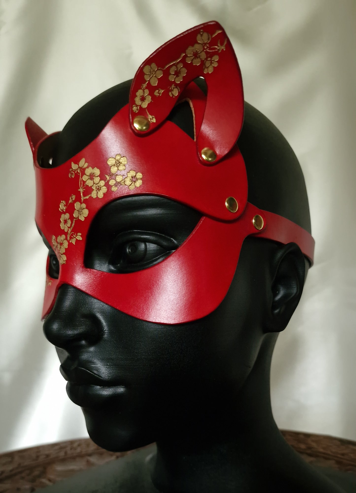 Red sakura kitten mask, handcrafted luxury.