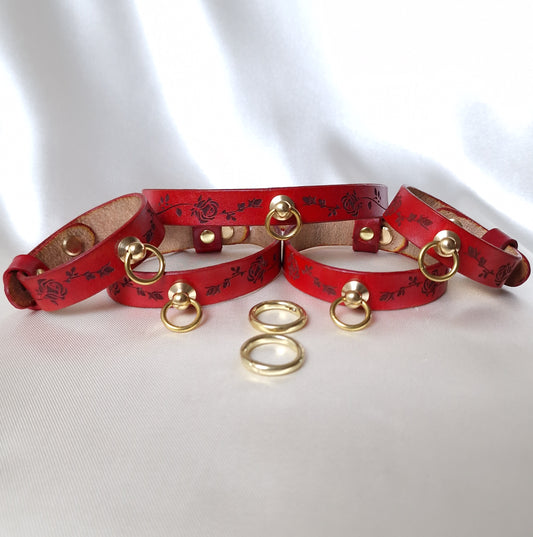 Minimal bdsm leather set—slim choker, wrist & ankle cuffs with engraved roses.