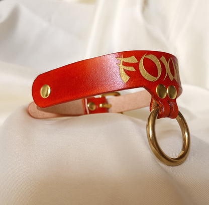 Side view of custom engraved leather choker showing engraved and painted details
