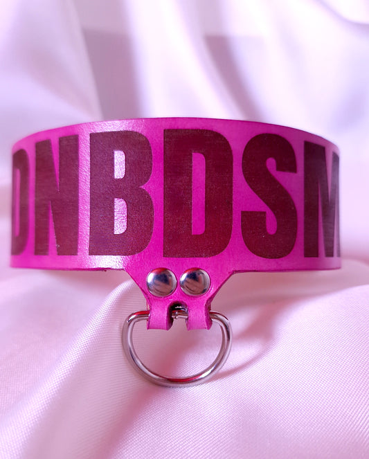 Front view of handmade pink leather DNBDSM choker with silver D-Ring