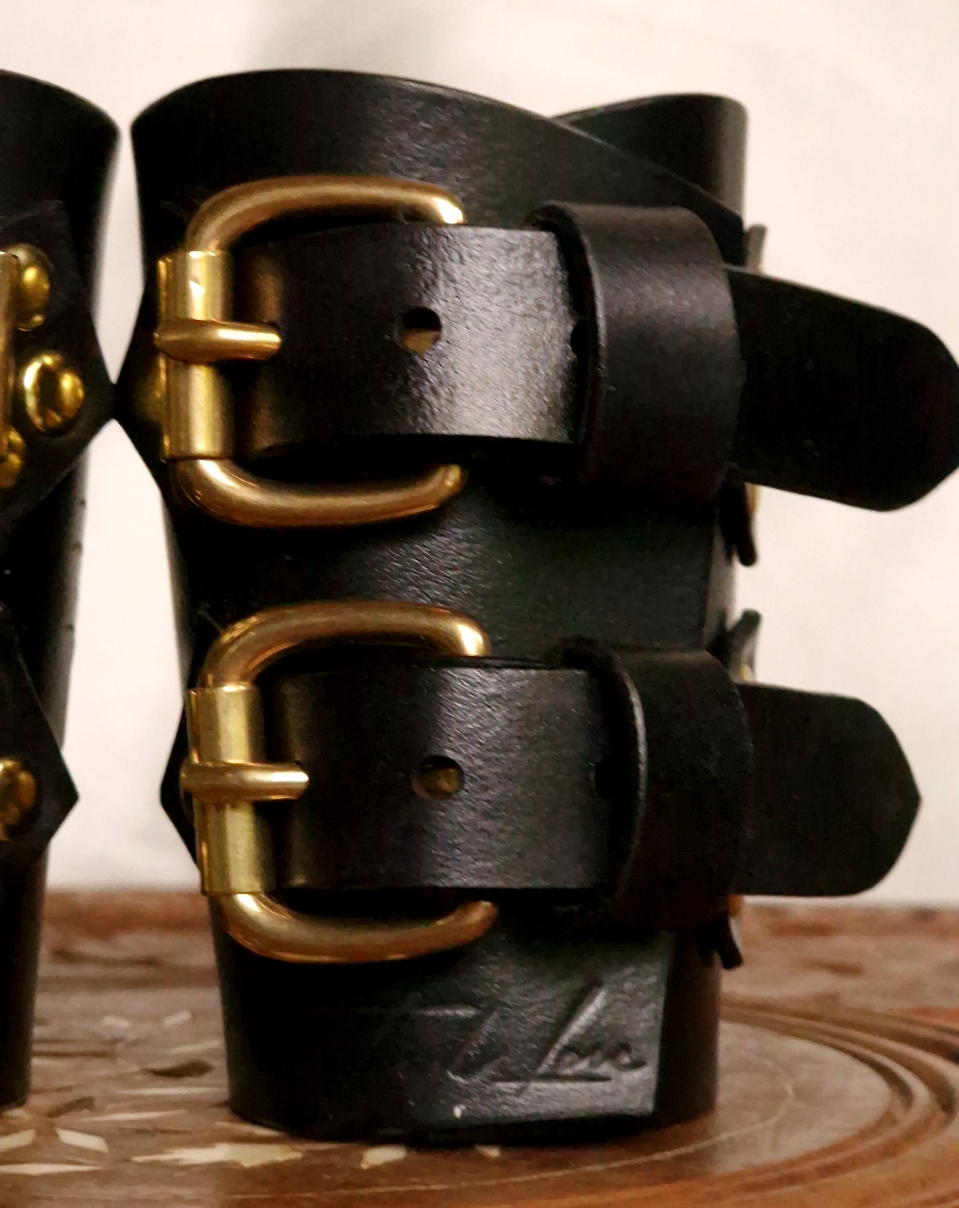 Dragon leather cuffs styled for fetish fashion. Many colors optional: black, red, pink, purple, brown, blue, green, orange and more.