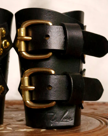 Dragon leather cuffs styled for fetish fashion. Many colors optional: black, red, pink, purple, brown, blue, green, orange and more.