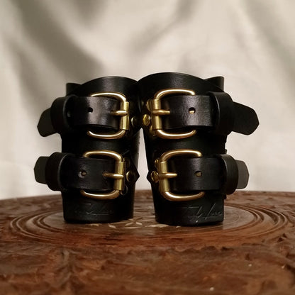 BDSM leather cuffs with D-ring attachments for hogties or leash.