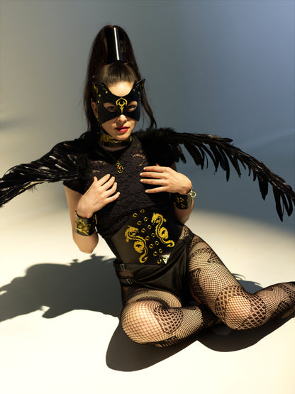 Complete dragon ensemble with corset and bondage restraints.