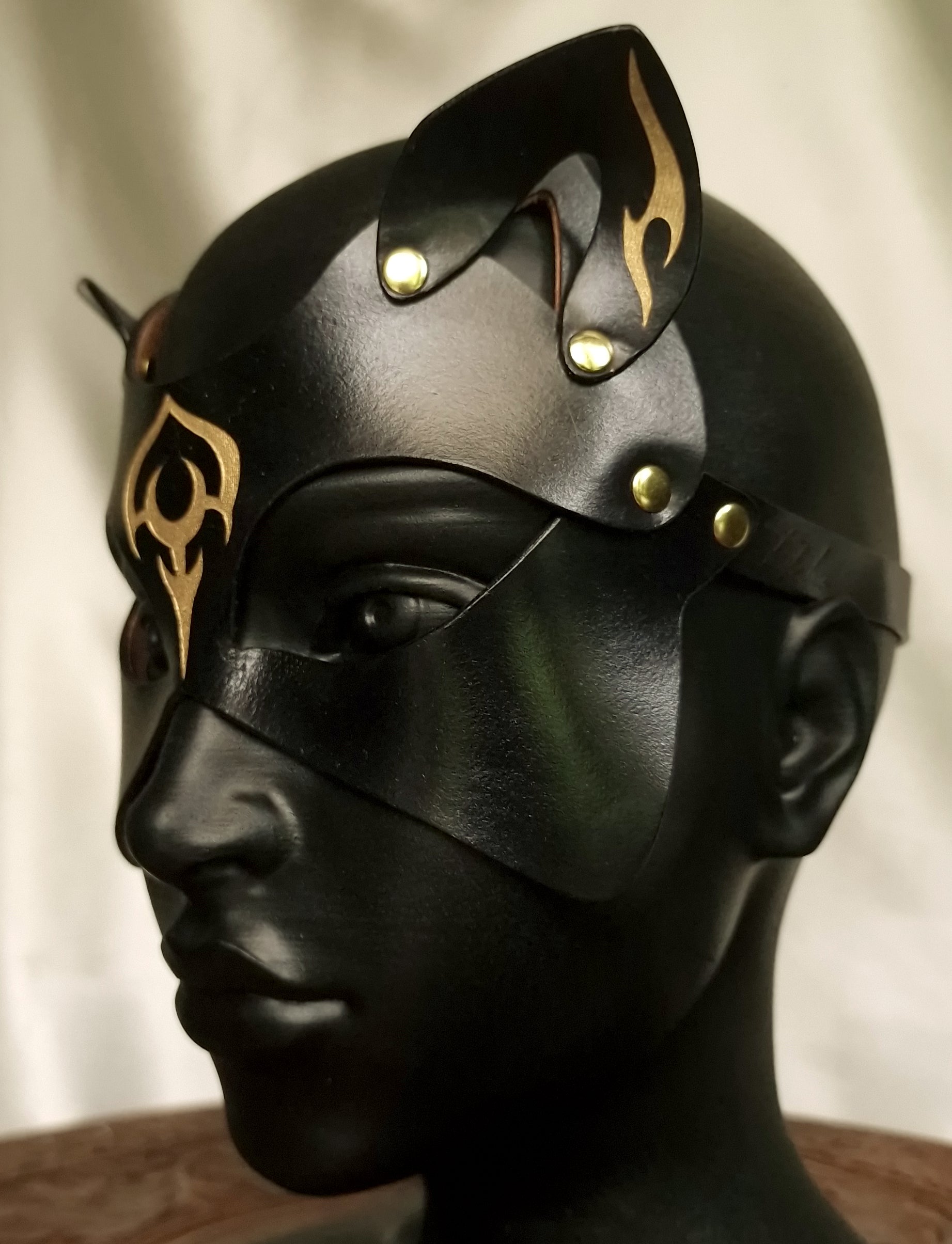 Fetish cat mask with ornaments and tattooes, sculpted shape.