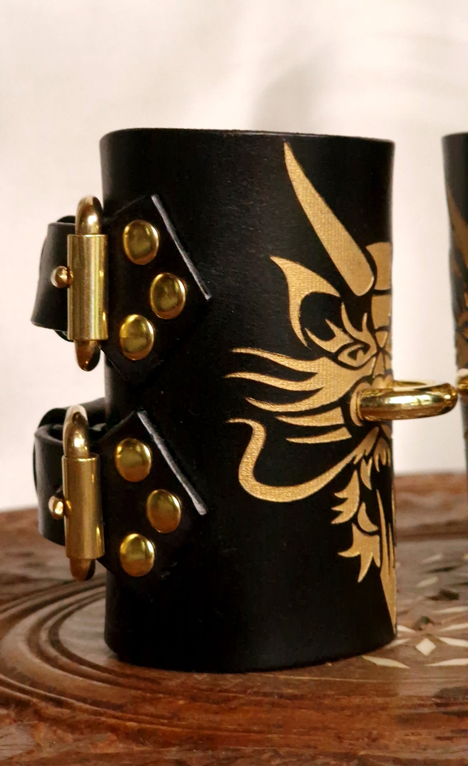 Side profile of dragon wrist cuffs, skin-safe interior. Safe for sensitive skin. 