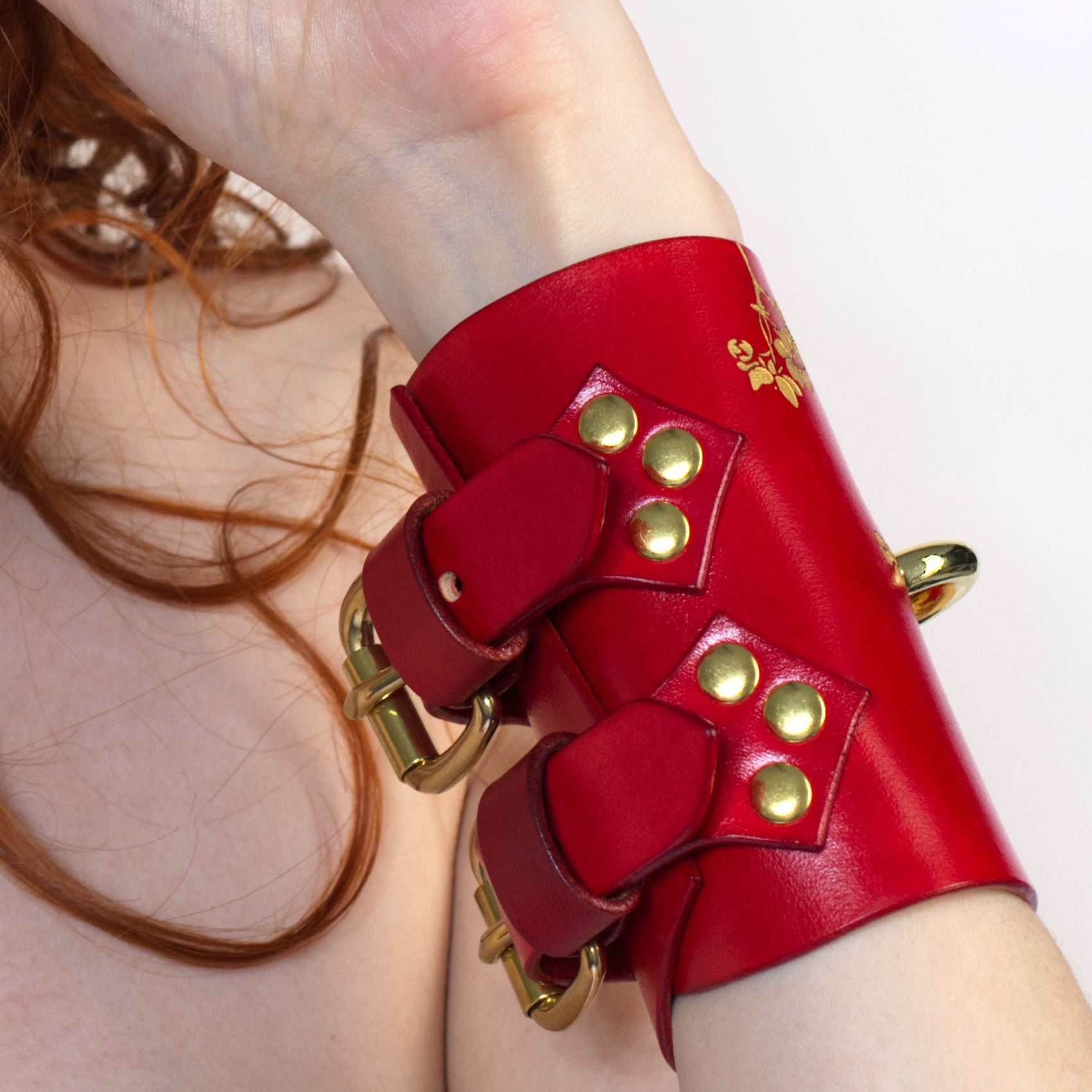 Luxury leather cuffs with floral engraving.