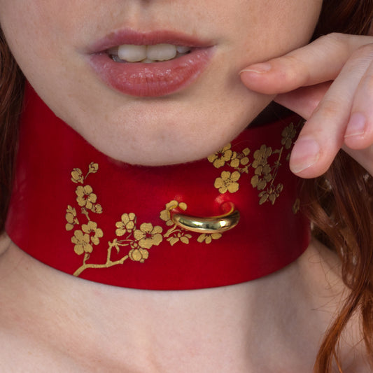 Sakura blossom floral leather choker with engraved gold cherry blossoms, micro-painted detail.
