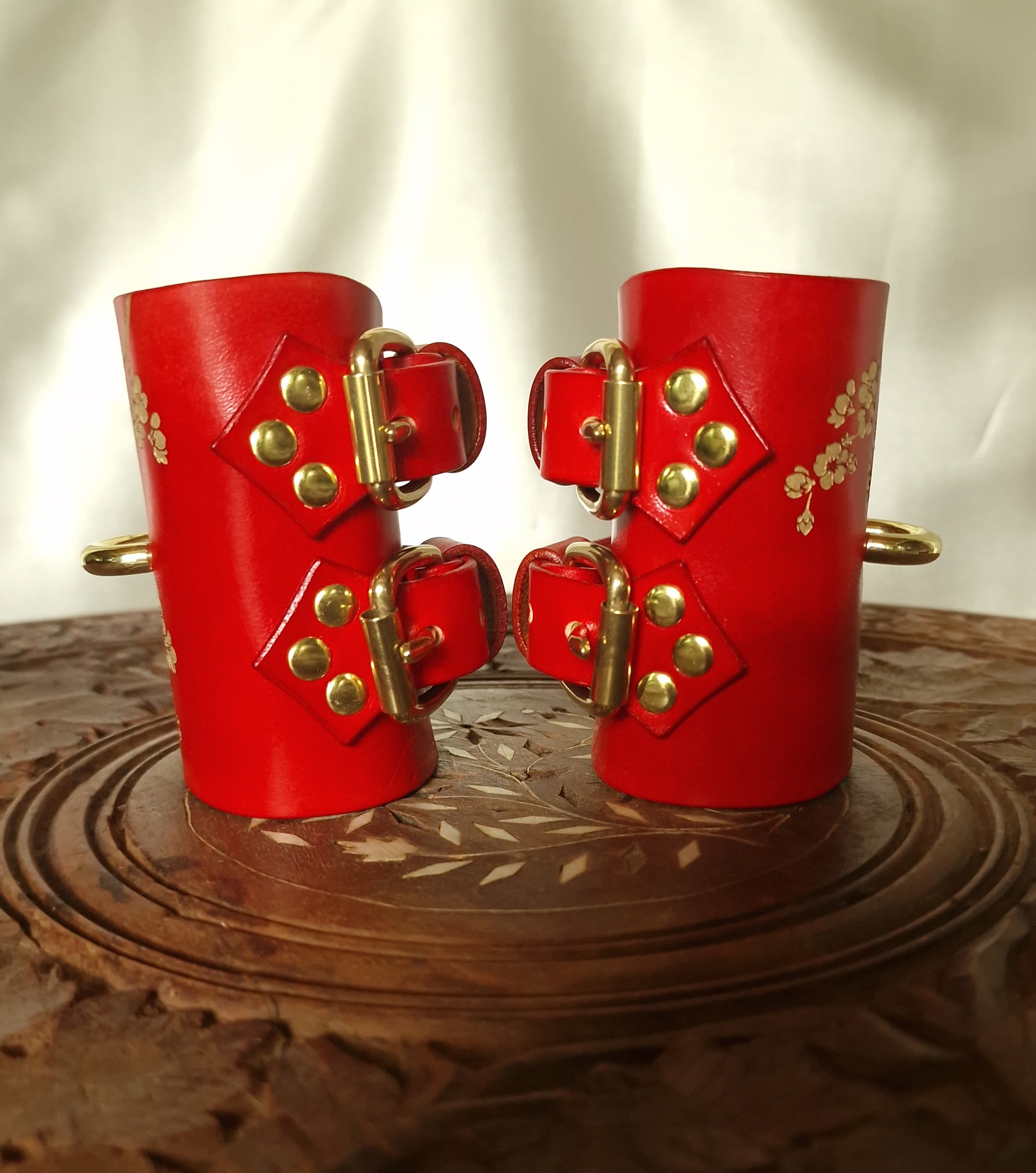 Side profile of sakura leather cuffs, skin-safe interior. Solid Brass buckles. Silver Hardware Optional.