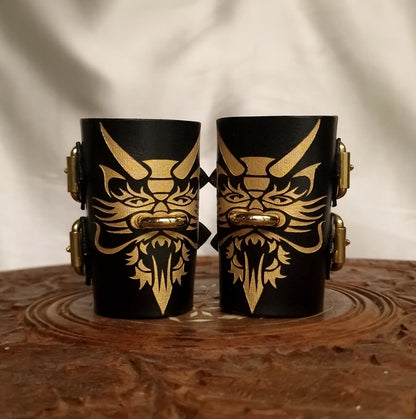 Totemic dragon wrist restraints—handcrafted and ornamental.