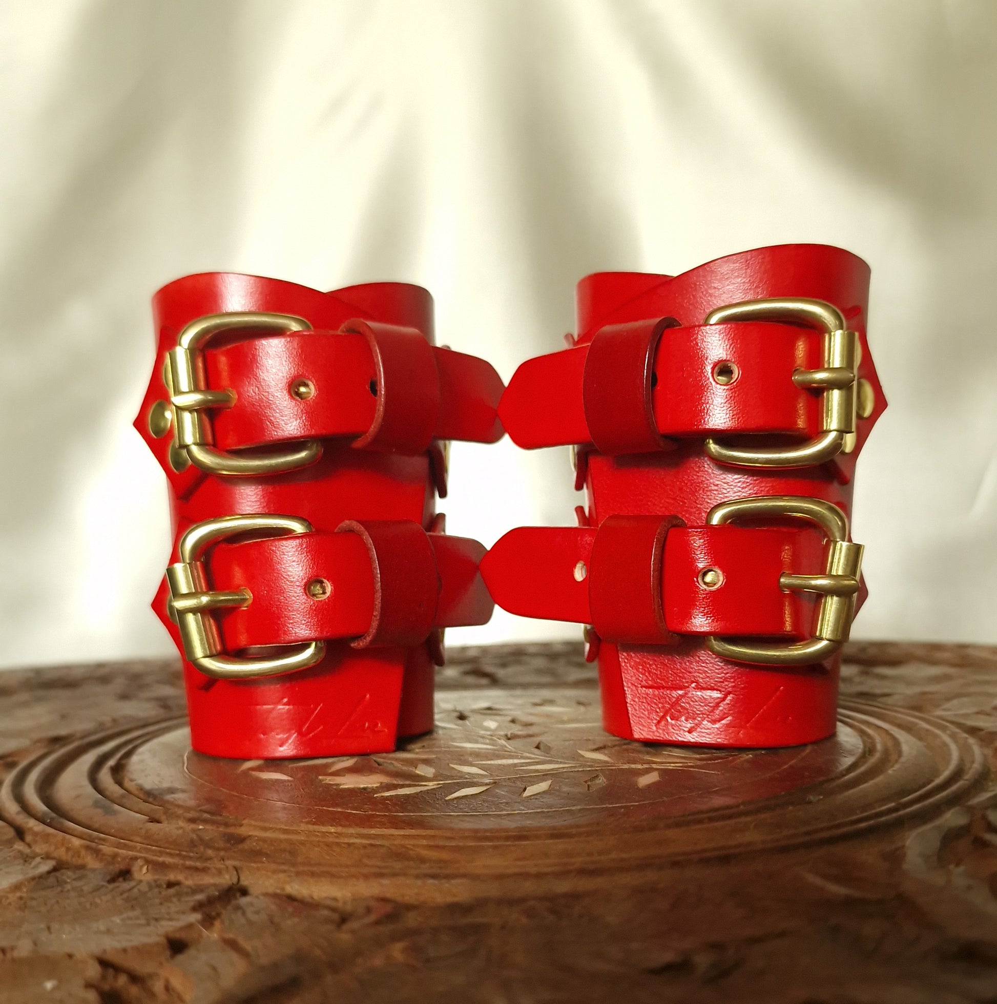 Ornamental wrist restraints in cherry blossom motif. Gold or Silver.