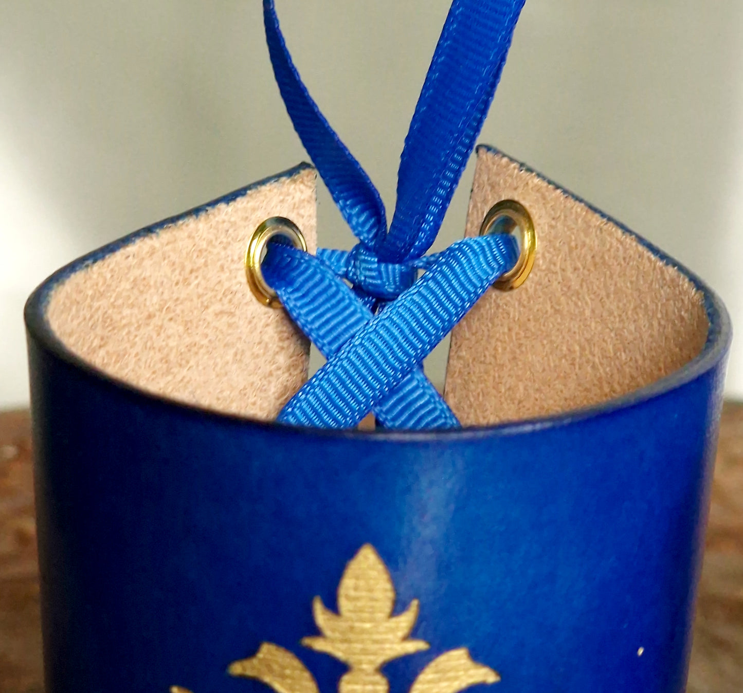 Engraved filigree detail on leather wrist cuffs.